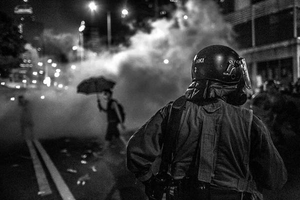 09.28HK_A protestor strolls through clouds of tear gas as police prepare to move in. <a href="/PolarisImages/">Polaris Images</a> #OccupyCentral