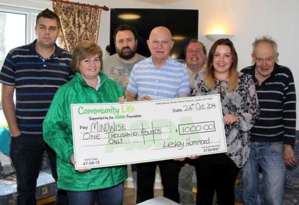 MindWise group receiving their cheque for £1000 from Asda Foundation.  Group will use to refurbish their common room