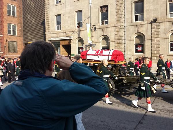 Civilians and soldiers alike salute