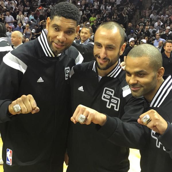 NBA's tweet photo. The @Spurs "Big Three" show off their latest hardware at Ring Night! http://t.co/18IHQumAqM