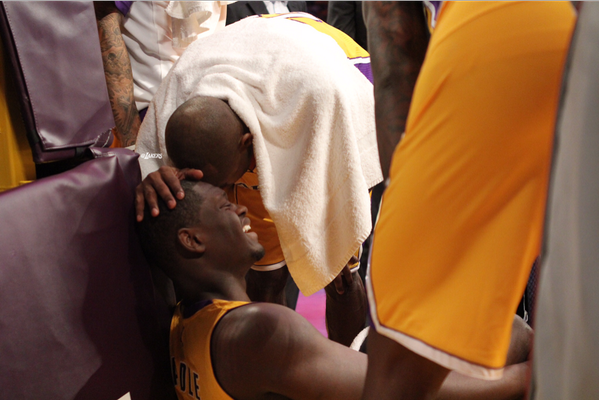 Kobe Bryant comforts the injured Julius Randle after during Tuesday night's game. (@Lakers/Twitter)