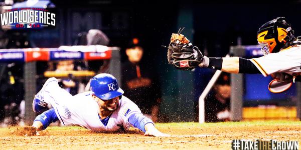 Royals's tweet photo. Here's Omar sliding to the plate for KC's ninth run.  #TakeTheCrown http://t.co/T7dtRiNU1I