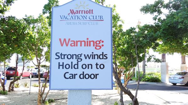 strong winds in Aruba, this sign, at Marriott, tries to explain.... wind so strong,your car door might go flying.