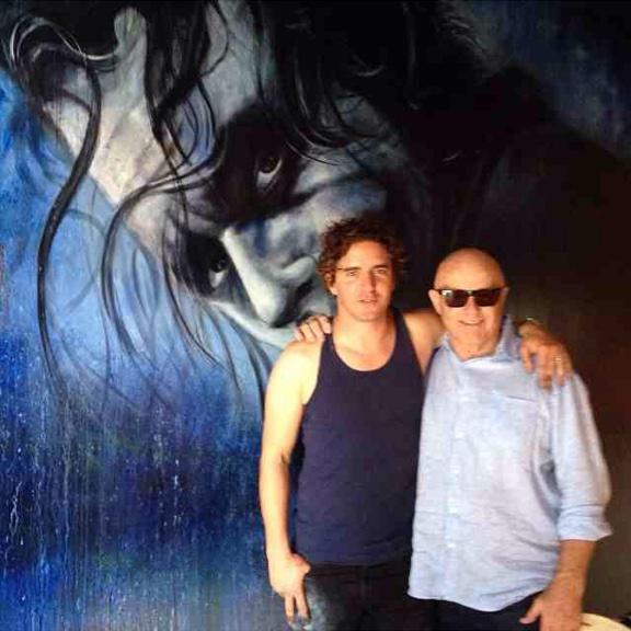 heathledgerfans's tweet photo. @vfantauzzo &amp; Kim Ledger in front of his latest Heath painting, a Joker mural in Perth #TDK #Joker #HeathLedger http://t.co/CaDegi0W3Y