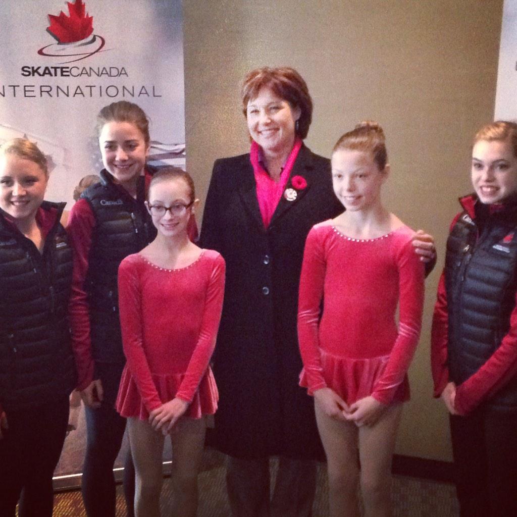 SkateCanada's tweet photo. .@christyclarkbc with @JulianneSeguin, @VeronikMallet, @AlaineChartrand, and flower retrievers #SCI14 http://t.co/XEyDDN5owb