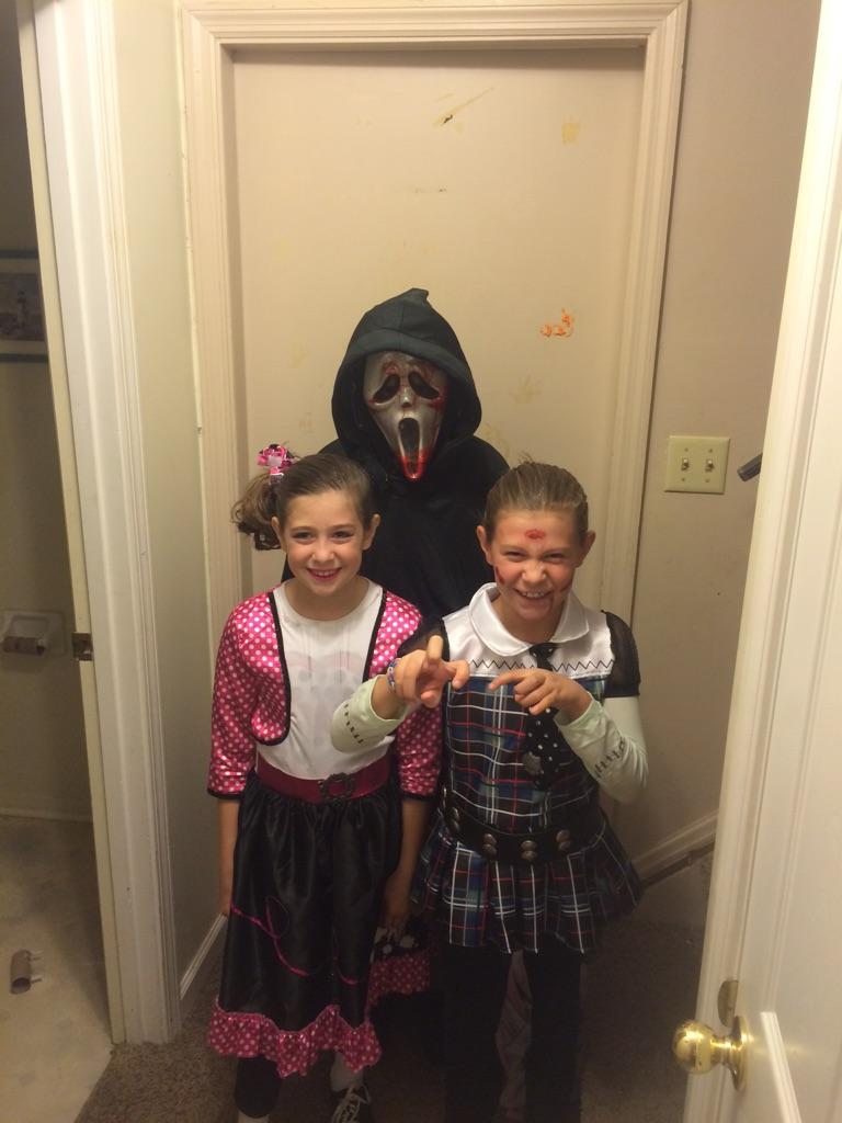 My kids ready to trick or treat in this nasty cold weather and guess who gets to do the walking yep this guy