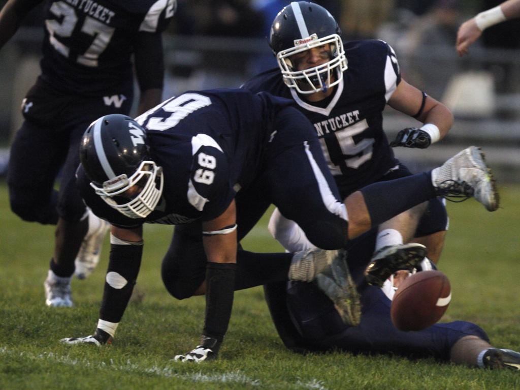 JPowersIM's tweet photo. @nhswhalers players go for loose ball in football playoff action vs Cohasset at home Fri. Cohasset up 7-3 at half. http://t.co/xKxwZUrtmD