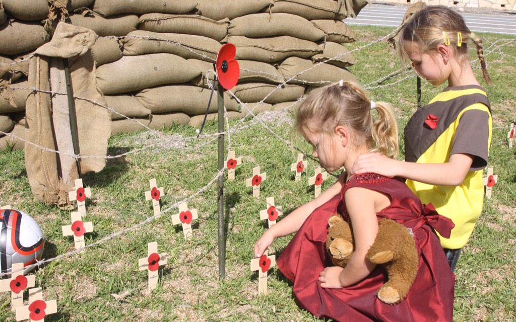 bfcyprus's tweet image. Susanna and Lucia Tully place a cross at a WW1 memorial in Episkopi's Happy Valley. #cyprus #bfc #RemembranceSunday
