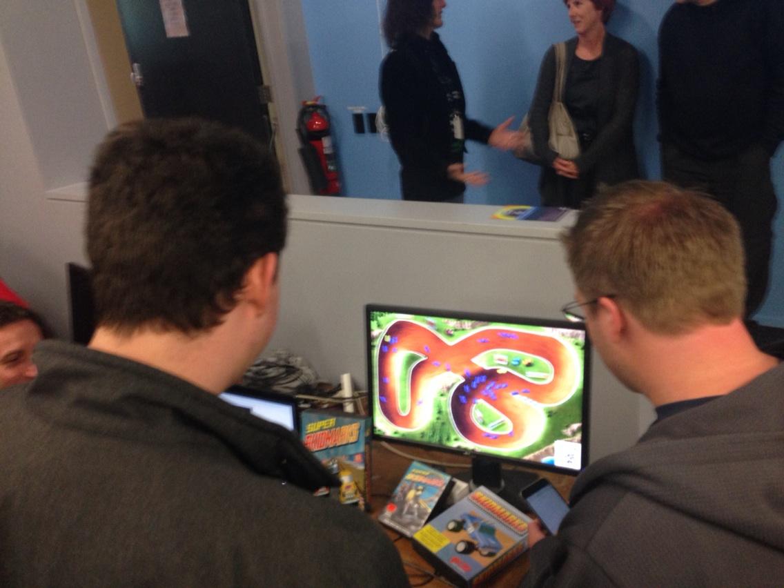 sknightly's tweet photo. Playing Kiwi Amiga and MegaDrive classic game Super Skidmarks using iPhone controllers at #techvananz @missingbytes http://t.co/oLNOTmsHwF
