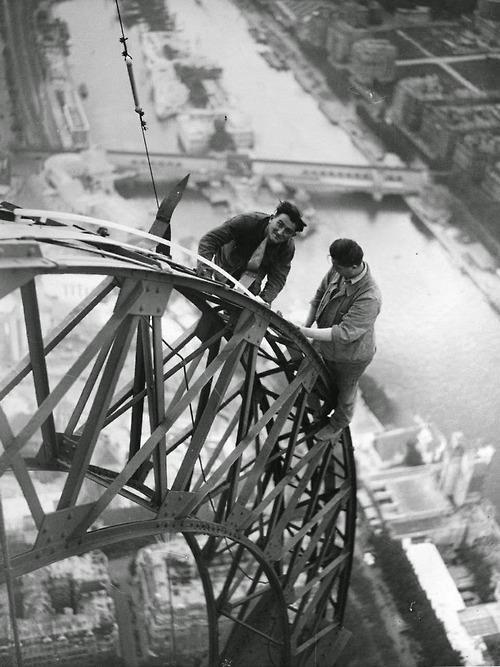 Electricians working on the Eiffel Tower, Paris, 1937