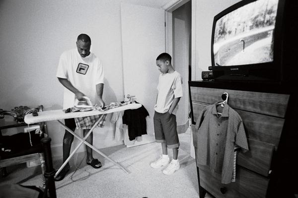 si_vault's tweet photo. Working on collection of behind-the-scenes pics from Hornets 2001 playoff run. Here's Hersey Hawkins ironing: http://t.co/UStgDWguTJ