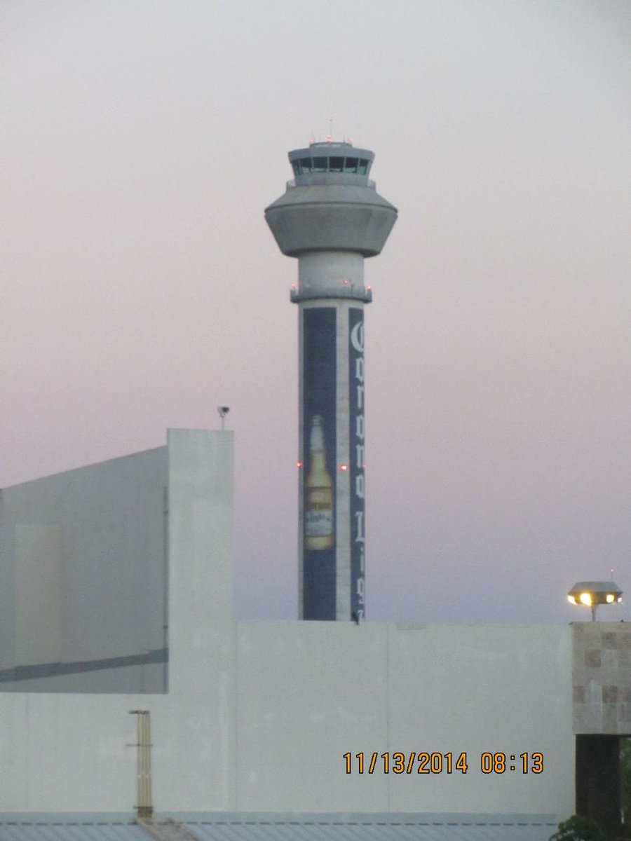 Pilot1Bill's tweet photo. Why would anyone want to paint a beer bottle on a control tower? Who can be first to correctly name this location? http://t.co/hxLzsdLwco