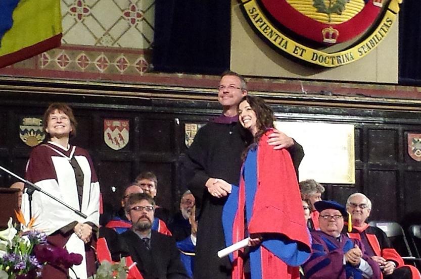 queensualumni's tweet photo. Tiziana Cotechini takes a moment on stage as she receives her doctorate at this morning's convocation #QGrad14 http://t.co/y4Zq18SSRl