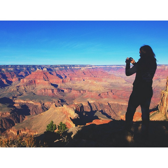 flyleafmusic's tweet photo. #TBT James taking pictures of this enormous rut in the ground. #GrandCanyon #flyleafontour http://t.co/uonB0fseKs