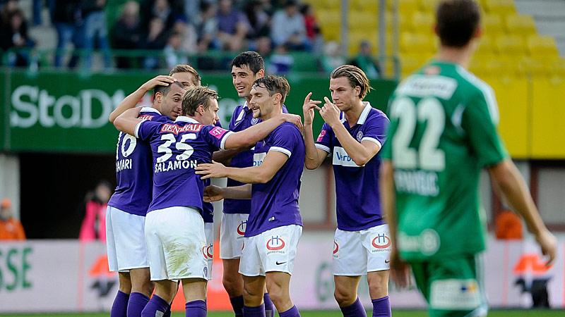 Shikov and teammates celebrate a goal