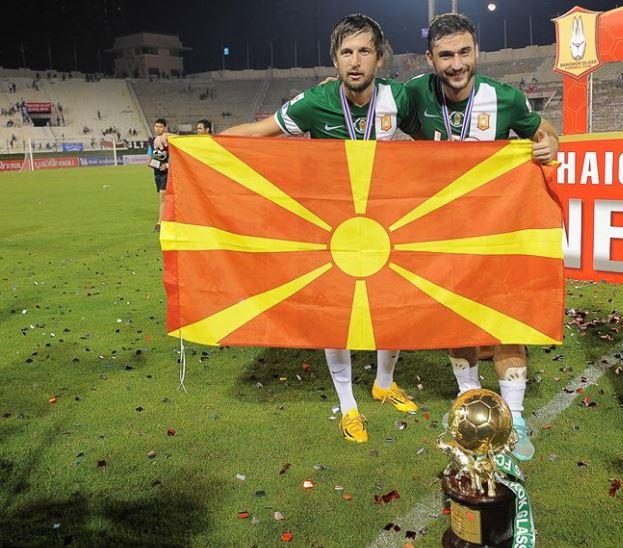 Tasevski and Ilijoski celebrate with the Macedonian flag