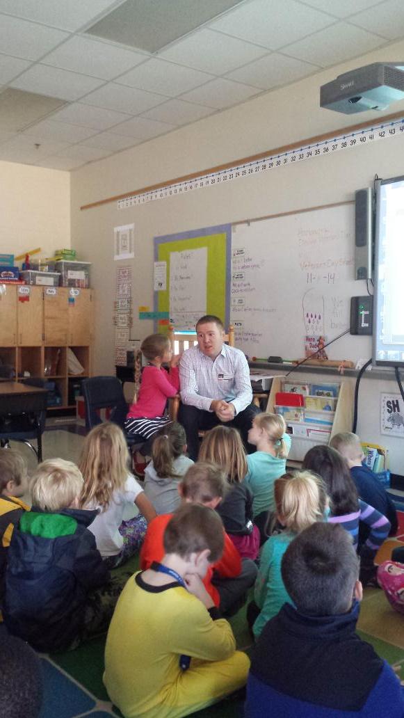 jvwashamcms's tweet photo. Mr. Holland, a veteran and a dad,  talking with Mrs. Keller ' s first grade class at J. V. Washam for Veterans' Day http://t.co/9nbKewyiUp