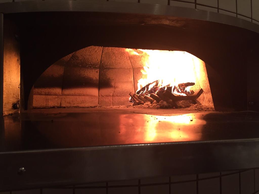 ChefPare's tweet photo. Stoking the wood fire for the fist time at @Caramba http://t.co/fieSCMQxGa