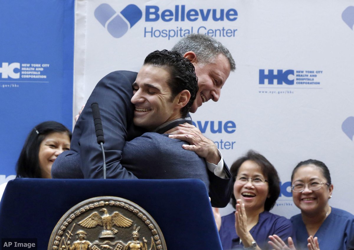 AmbPower44's tweet photo. Mayor de Blasio embracing Dr. Craig Spencer like Pres. Obama embraced Nina Pham, and how world must embrace W. Africa http://t.co/mfJSKtrFZE