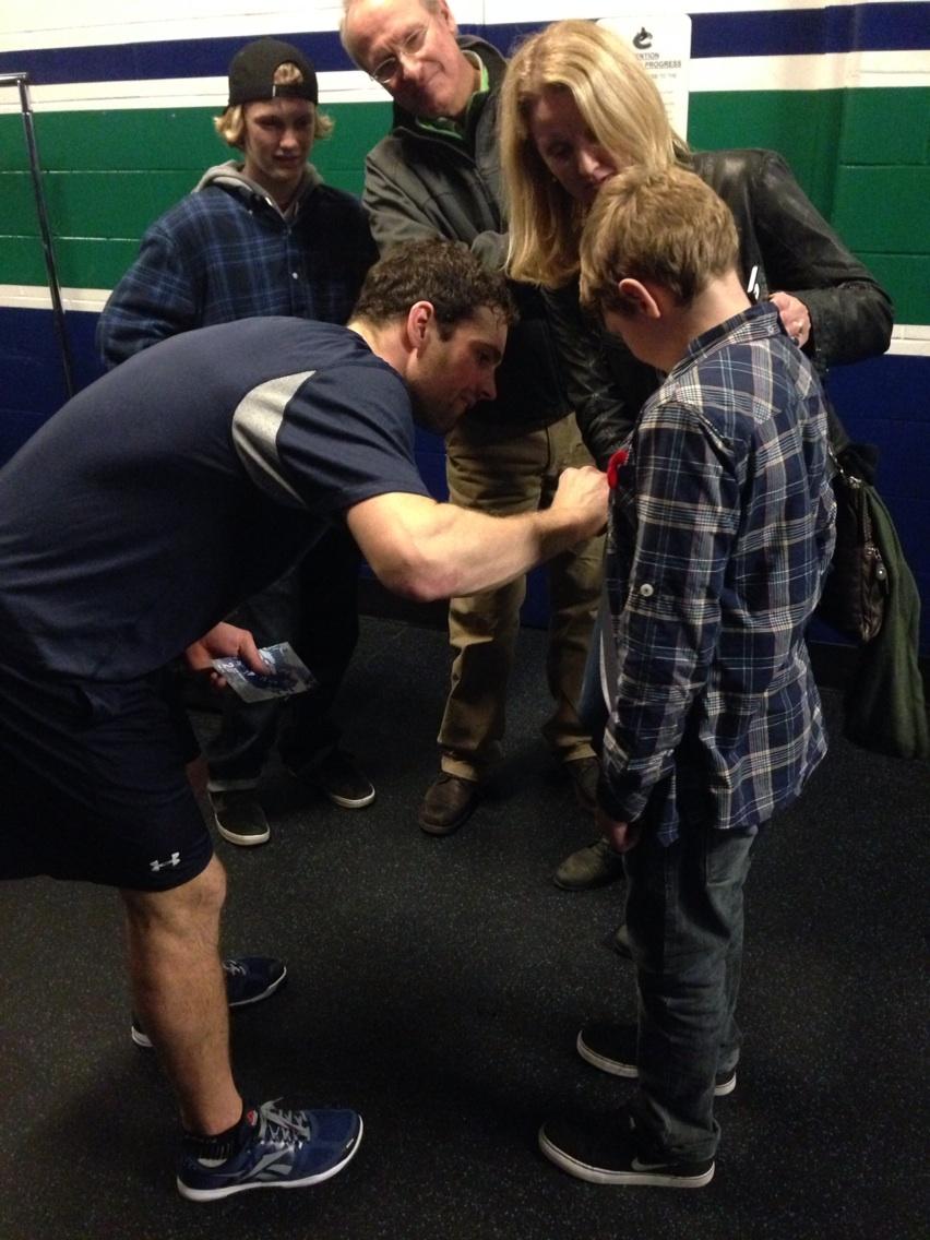 Dan Hamhuis added some ink to Ben's shirt. Ben was Hammer's Hero tonight and is a huge supporter of <a href="/hannahsheroes/">Hannah's Heroes</a>.