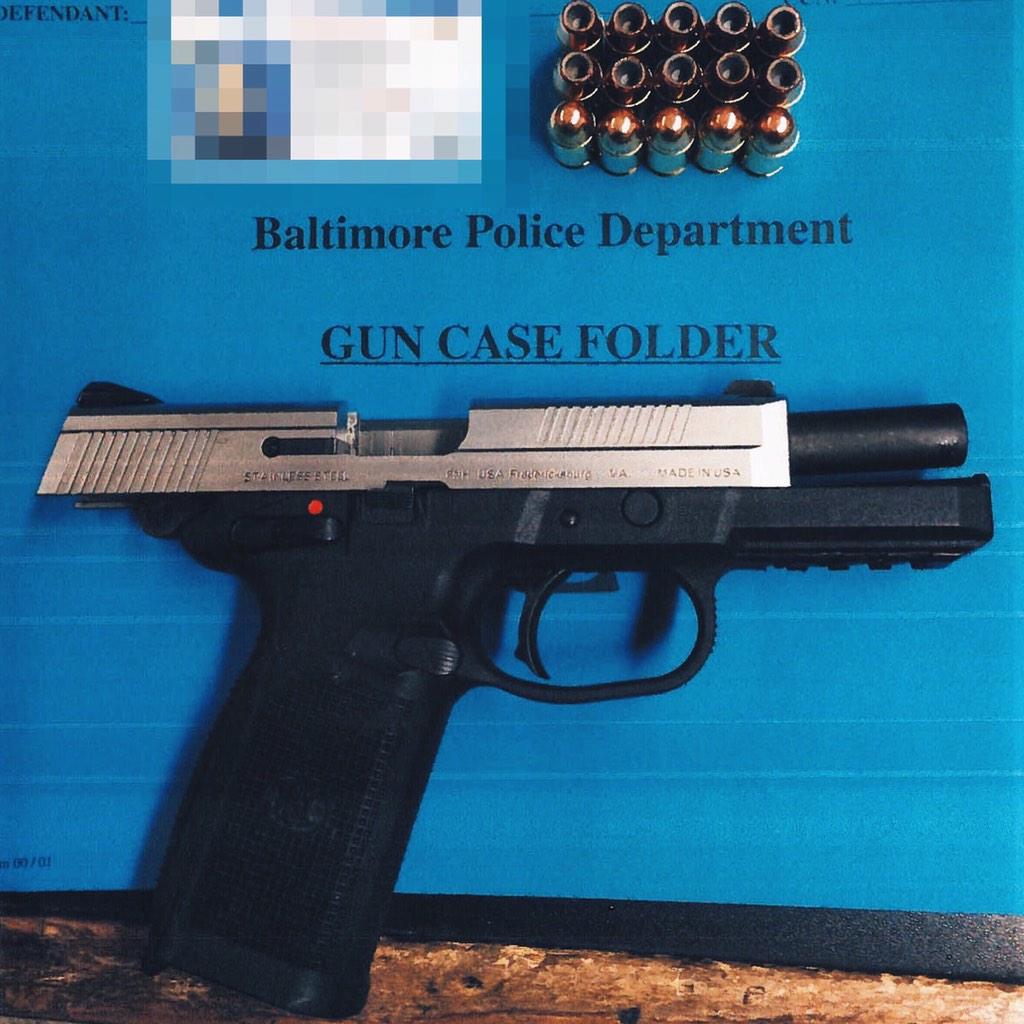 BaltimorePolice's tweet photo. Western District Officers arrest armed man at 1600 W. Lexington St, Seize loaded .45 cal gun. #ASaferBaltimore http://t.co/CVnsHhI5YN