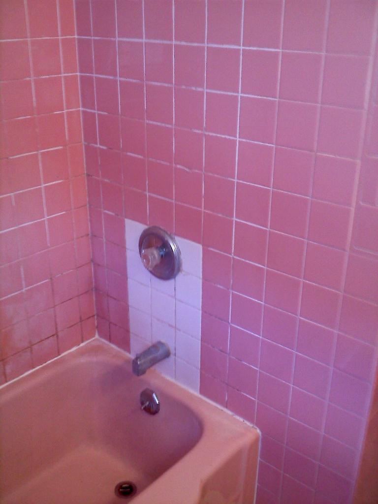 Tub and tile before we refinished them