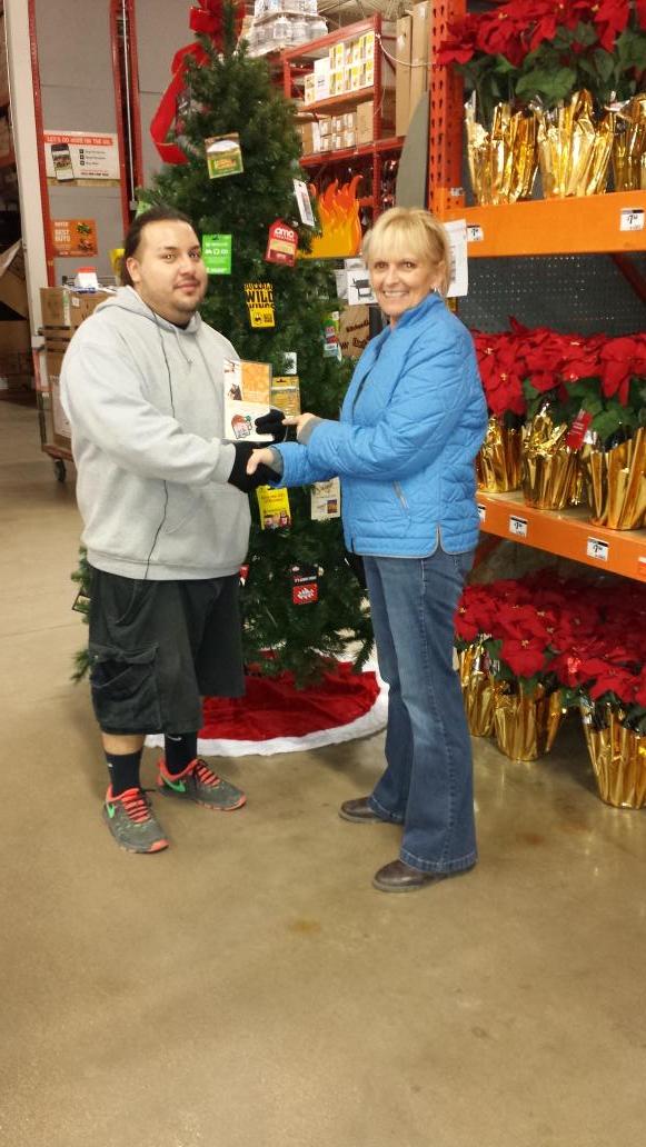 554's D28 associate Mando receiving Homer badge from DS Andie for doing the  ballards to protect Millwork display