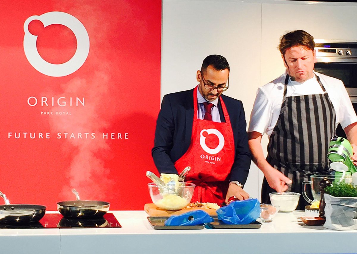 Akthar Alibhai from @ColliersUK on stage cooking with James Martin at the @OriginParkRoyal launch event