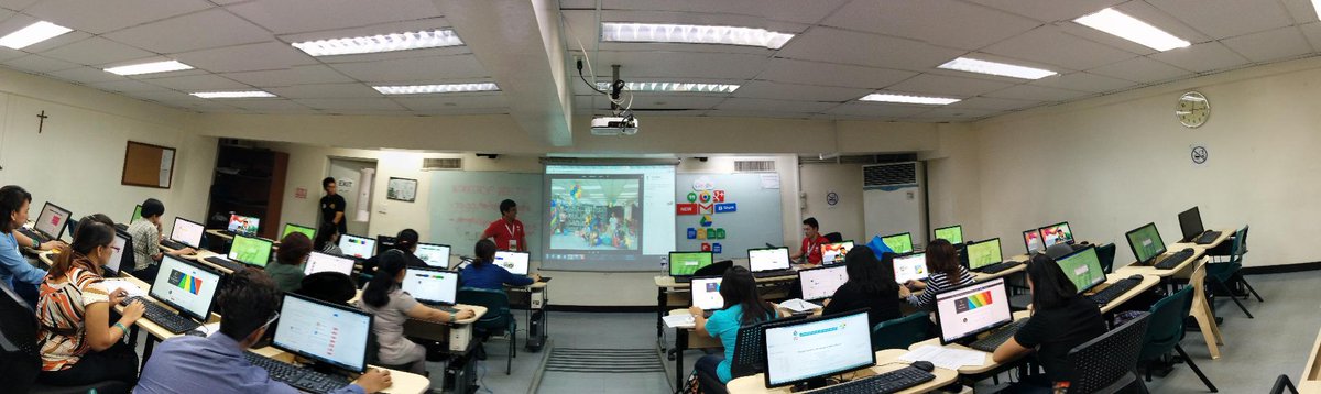 Trainer Iosif and JK handing out materials for their next activity with Class Mabini #GTWMetroManila #GEGPhilippines