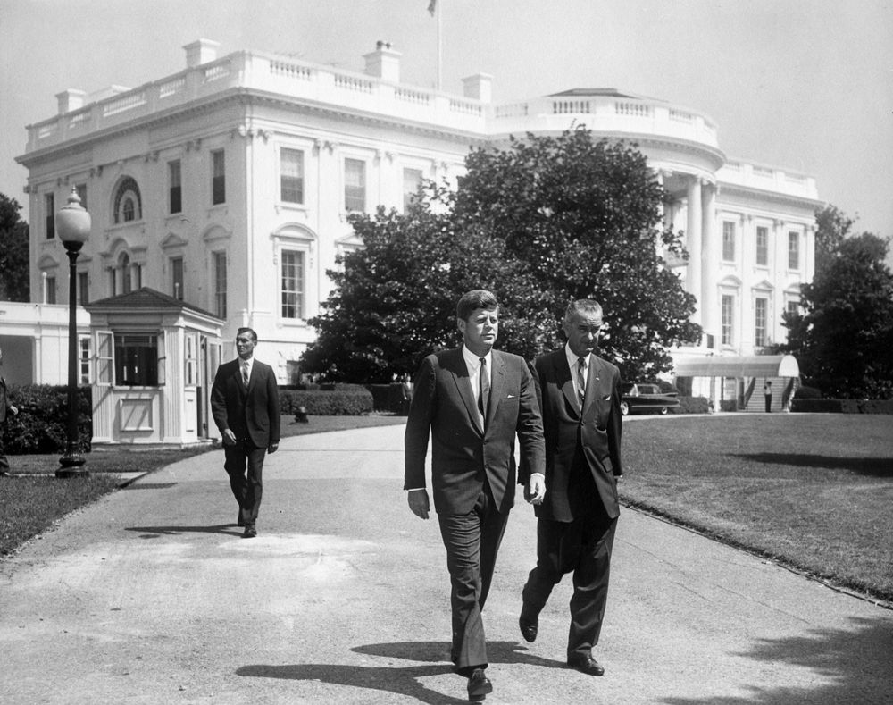 RealTimeJFK's tweet image. From Aug. 31, 1961: Kennedy and now-President Johnson walking across the South Lawn driveway.