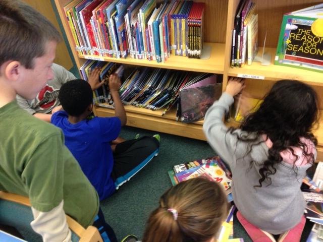 media_teacher's tweet photo. Students adopting a shelf and taking ownership of the media center. #wonderwake #nctlchat @wcpssitlms http://t.co/lc7mgfOt8t