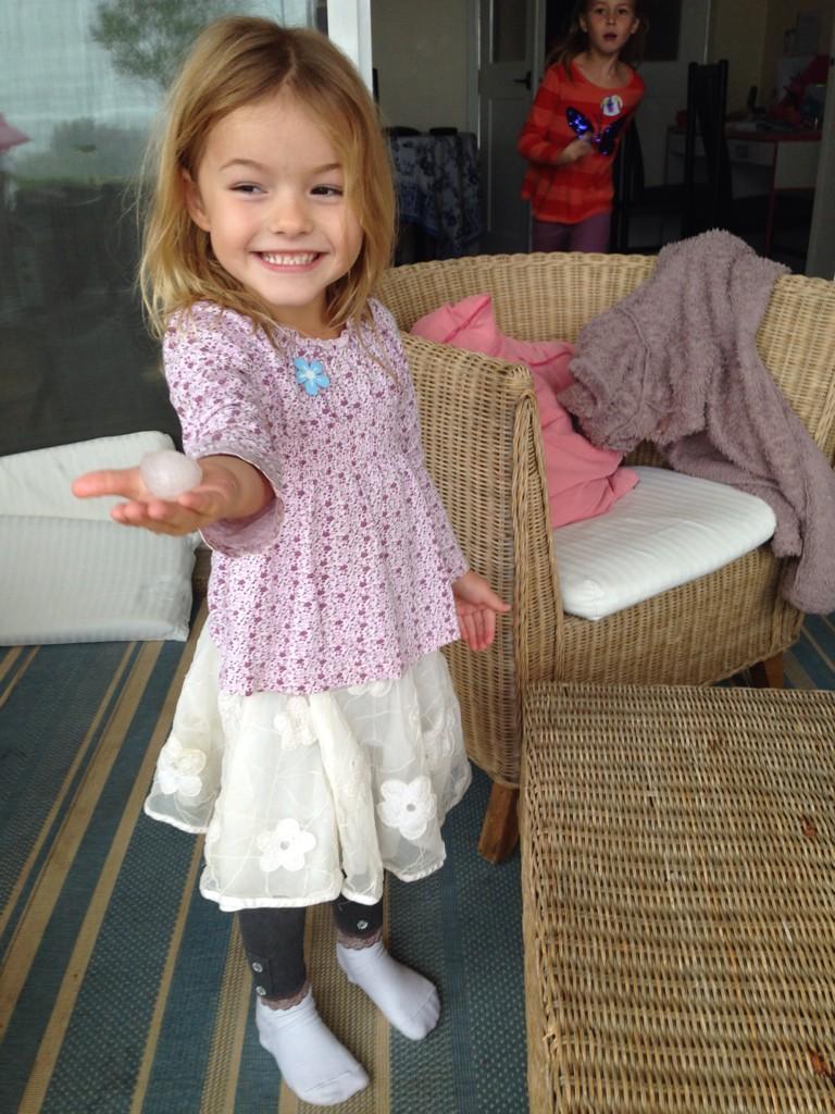 SeanTully3's tweet image. 0945 Sat15 Nov freak storm hits Bases 5 cm hail stone held by Episkopi primary school pupil Susanna