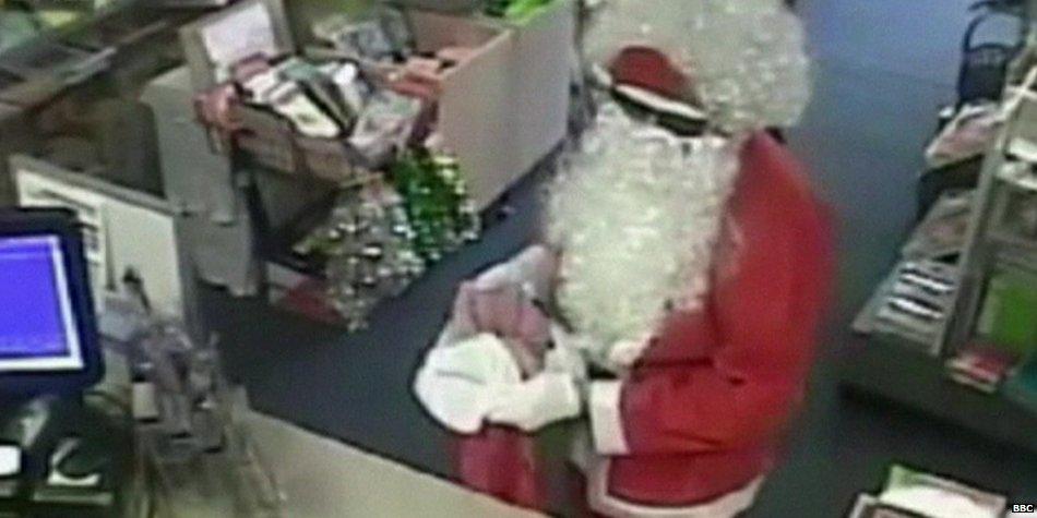 BBCWorld's tweet photo. Police search for bad Santa caught on tape robbing Melbourne post office http://t.co/513KnqKkRT http://t.co/gOQDbgQTdx
