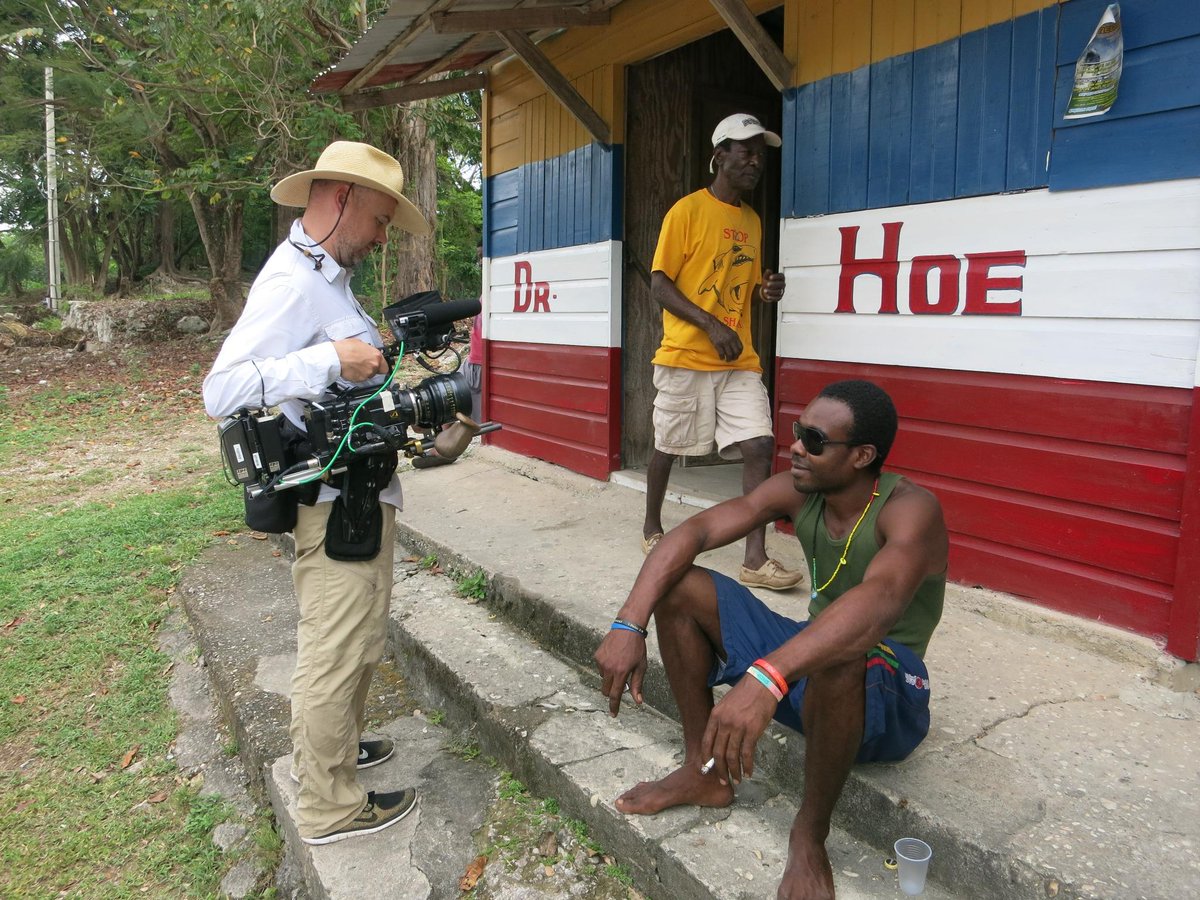 ZPZProduction's tweet photo. Director of Photography @zachzamboni in front of Dr. Hoe, a local rum bar at James Bond beach. #PartsUnknown http://t.co/5pdzgaEIBn