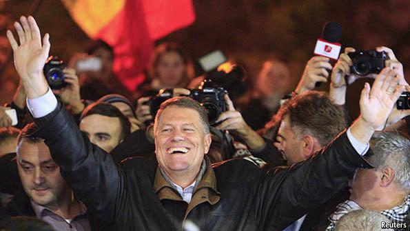 TheEconomist's tweet photo. A 55-year old former physics teacher unexpectedly wins Romania's presidential elections http://t.co/Xc9rxf2Ouf http://t.co/gJY8XzVarc
