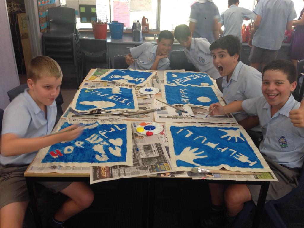 SJSyr62014's tweet photo. Year 6 students are busy creating their #graduation banners our end if year mass. http://t.co/QHoMKWvBbB