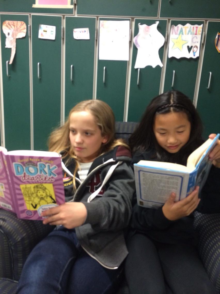 Two sixth graders + 2 books + One comfortable chair= excellent reading!