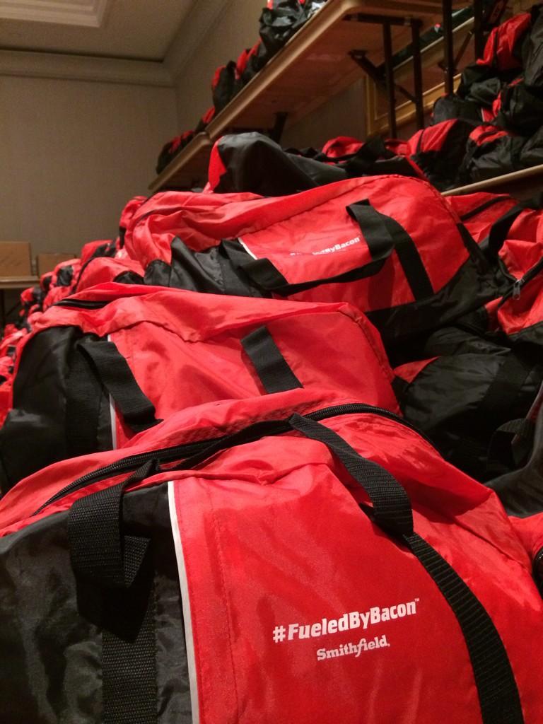 GlobalBiz's tweet photo. Hundreds of bags! Thanks @SmithfieldFoods for the awesome #fueledbybacon bags! #OFII20 http://t.co/x9alsz9wKV
