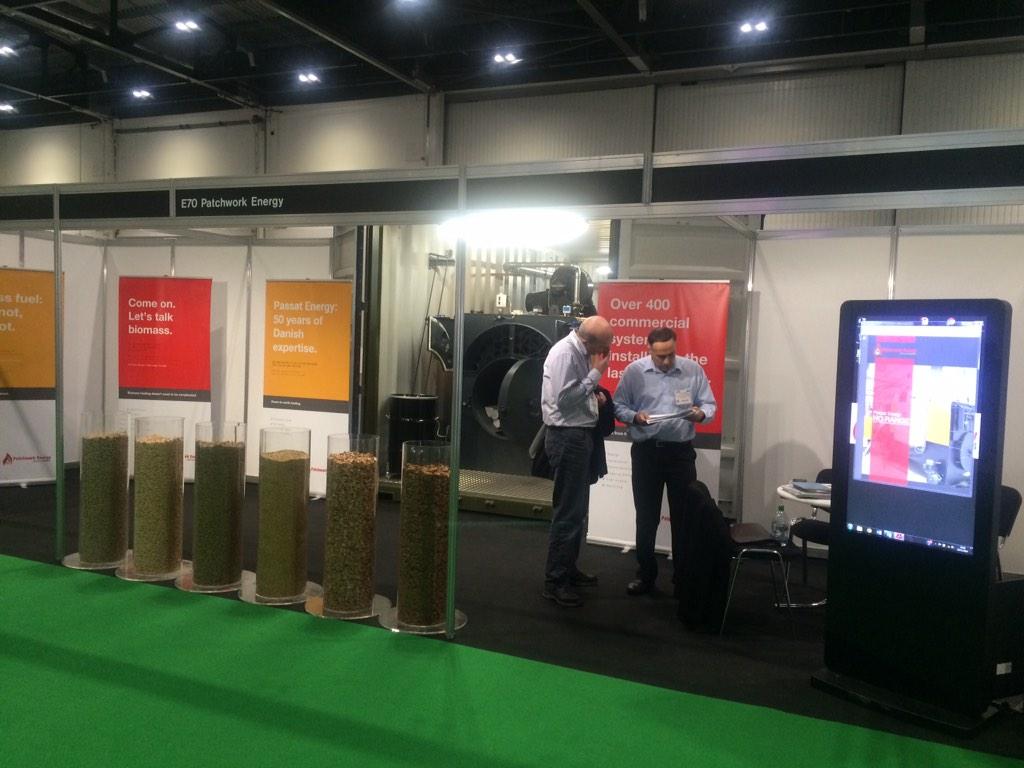 PatchworkEnergy's tweet photo. Boys working hard showing everyone our #biomass boiler, come visit &amp; take a look yourself! #rhi #emexlondon #standE70 http://t.co/6PgKIbUw6d