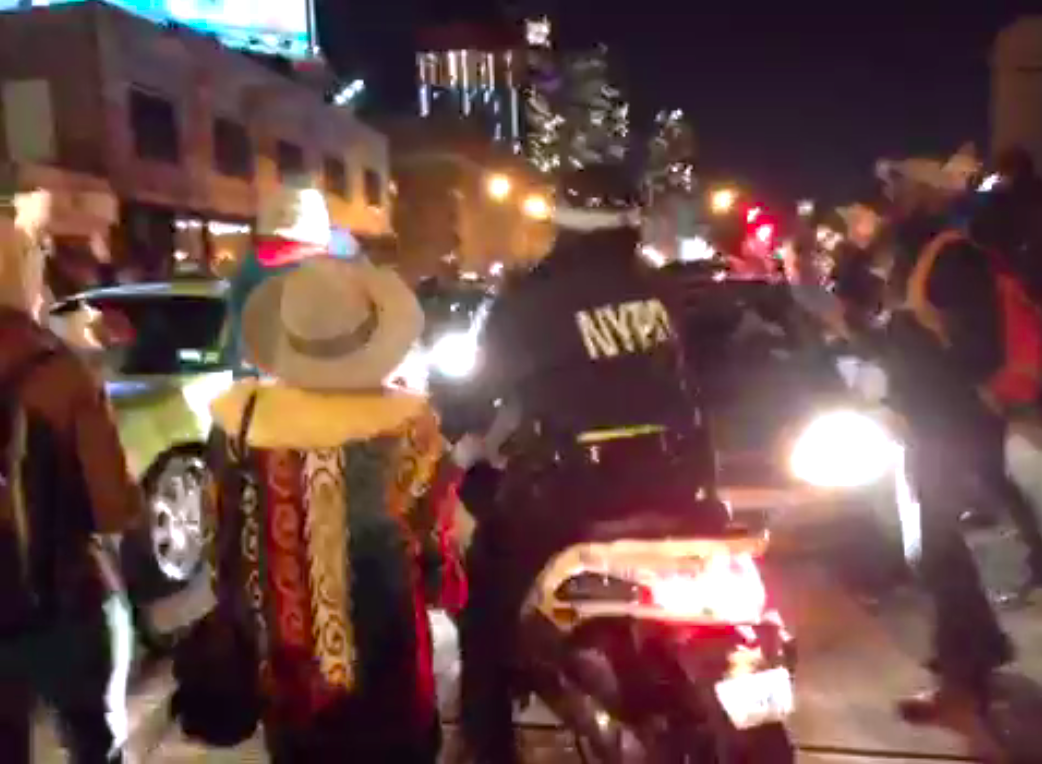 OWSLibrary's tweet image. #NYPD just gave up and drove away. First time I've seen the back of a cop. #EricGarner #ShutItDown #BlackLivesMatter