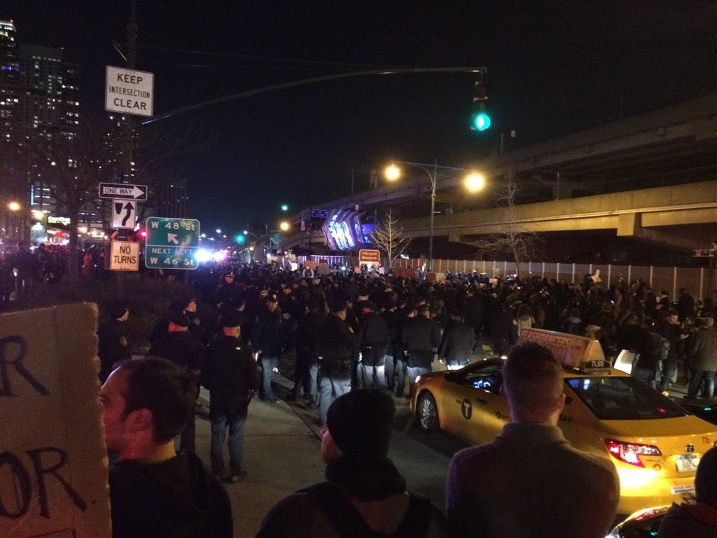 There are now riot police on scene at 12th Ave and 49th St in NYC. Crowd of Eric Garner protesters is not moving.