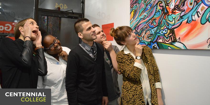 CentennialTODAY's tweet photo. "How very post-modern!" @ArtInActionTO organizers admire some art at last night's @SKETCHToronto benefit show http://t.co/lFM5b28m2u