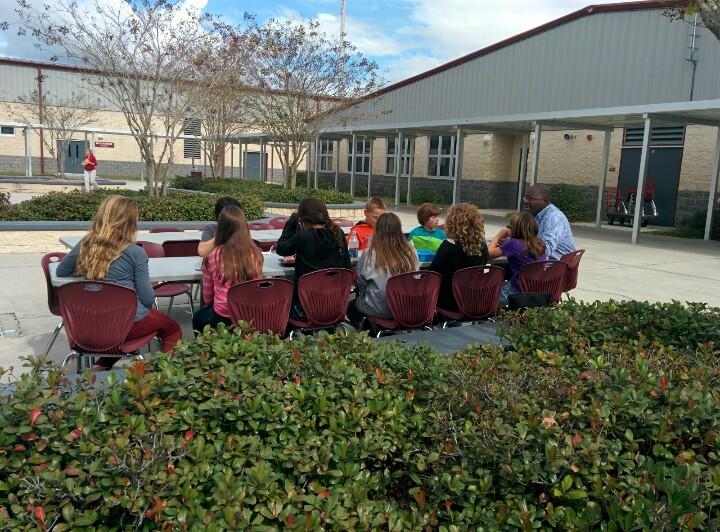 LonghornAP's tweet photo. Mr. Hall, school counselor, meets with members of Longhorn United in the courtyard during lunch. #jlms #Pasco2gether http://t.co/bra6ohsgaZ
