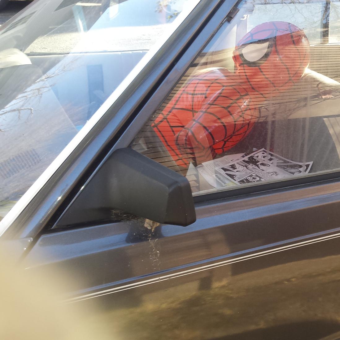 asininehead's tweet photo. A disheveled Spider-Man wakes up in a car full of small press comics. http://t.co/17fiVIJz4F