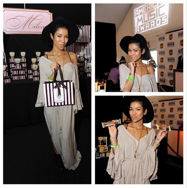 AMAs's tweet photo. .@JheneAiko was spotted hanging out in the @UPS Gifting Suite at the #AMAs. Look at all the swag she picked up! 👜🍫👒 http://t.co/gRuTHV0t3v