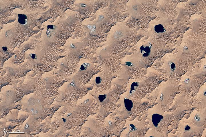 NASAEarth's tweet photo. Megadunes and Desert Lakes in China http://t.co/XTIHLnm31H #NASA http://t.co/DbuDiGgEkm
