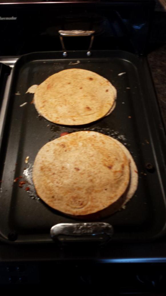 dongreetham's tweet photo. Pizza quesadillas!  Oh yeah. http://t.co/wfd73aLkui