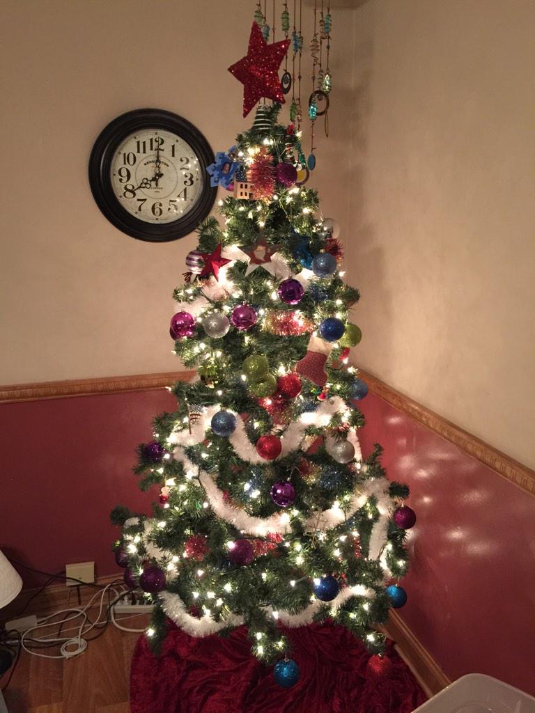 tiffaniward78's tweet photo. Faith put up the tree, cat has broke so many branches it looks like a toilet bowl brush! #stupidlookinchristmastree http://t.co/Vxj50w0uww