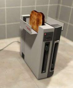 GamingNostalgic's tweet photo. I saw this cool looking toaster and now I want it lol

#Nintendo #NES #Toaster #NintendoEntertainmentSystem #gadgets http://t.co/IsuUgZd96U