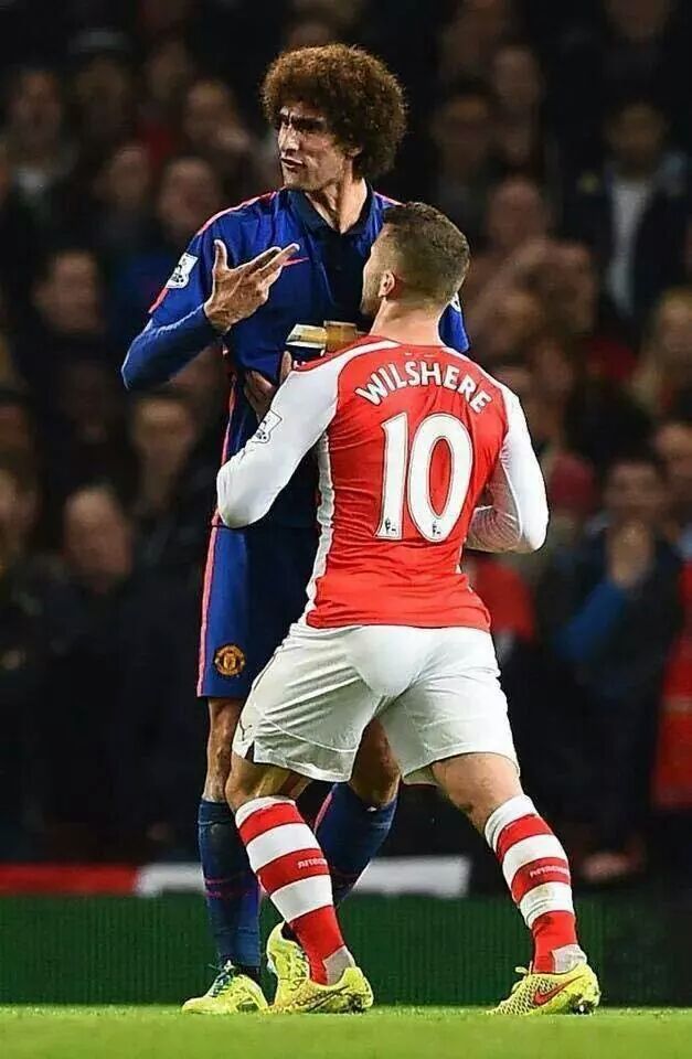 Danny_McMoomins's tweet photo. Am I the only person who sees Fellaini obstructing Wilshere as he as he carries cans of Strongbow &amp; Special Brew? http://t.co/7L6dqb2j99